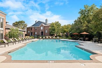 Resort-style swimming pool with expansive lounge deck